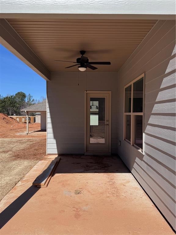 View of patio featuring a ceiling fan