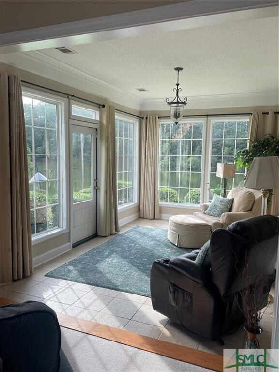 Beautiful Sunroom with door leading to an outside 