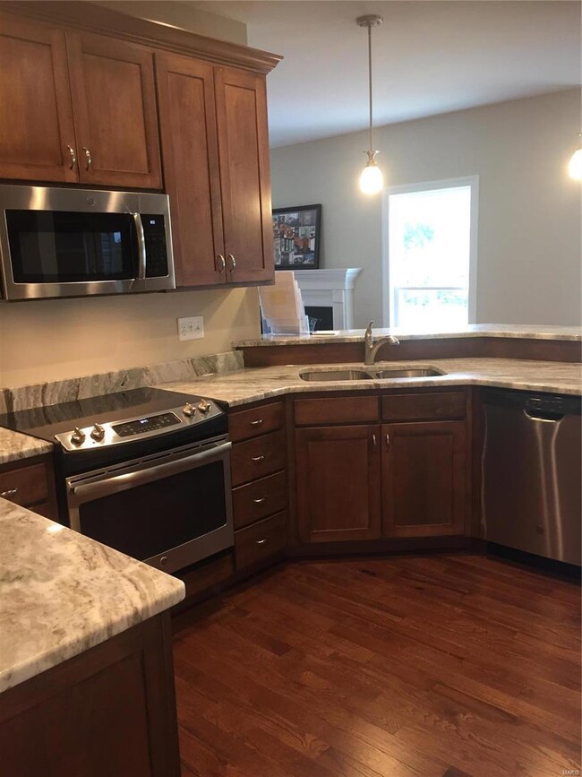 Custom wood kitchens with hardwood flooring, stain