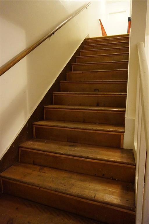Wide Wooden Staircase in Unit B.