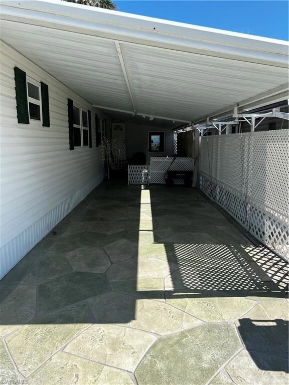spacious carport with pressed concrete floor
