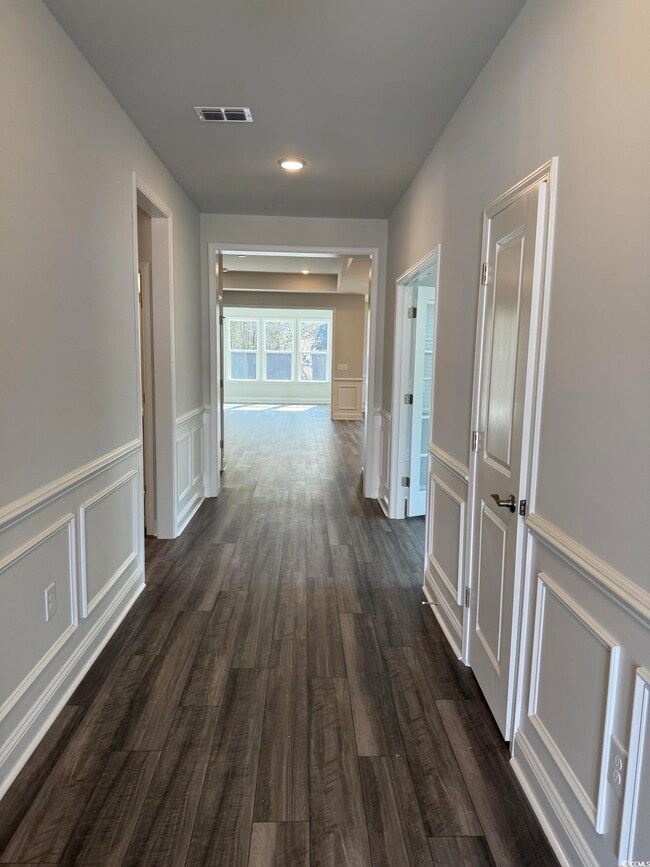 Corridor with dark wood-type flooring