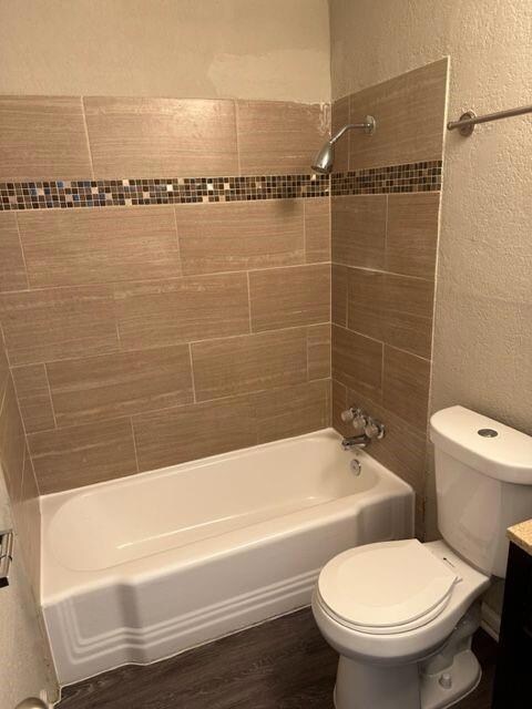 Full bath featuring shower / bath combination, to