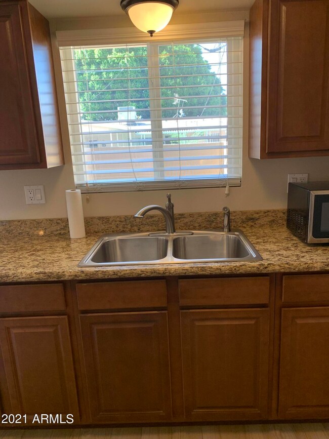 KITCHEN LOOKS OUT TO PRIVATE PATIO