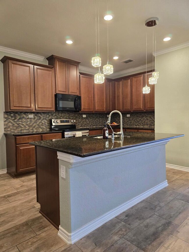 Kitchen with crown molding, stainless steel elect