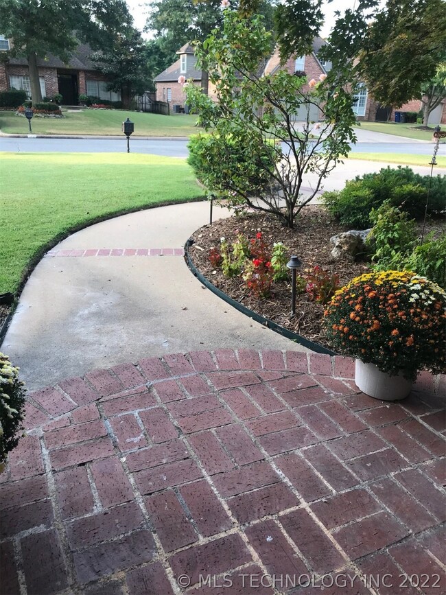 Extra touch! Covered brick porch with brick insert