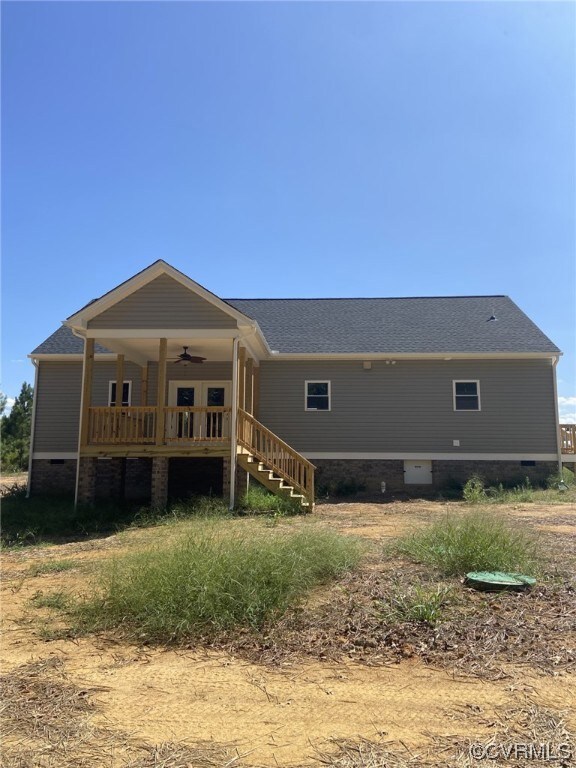 Back of property featuring covered deck w/ceiling