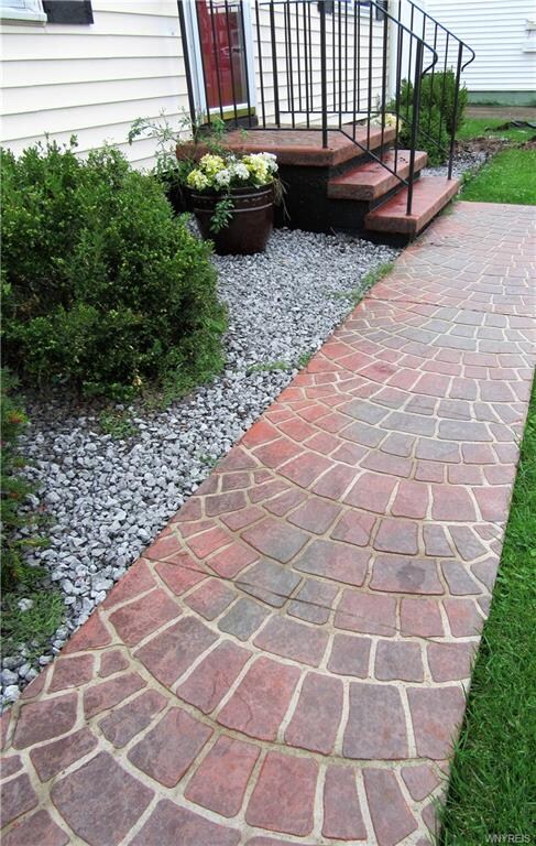 updated concrete driveway, patio and artistic stam