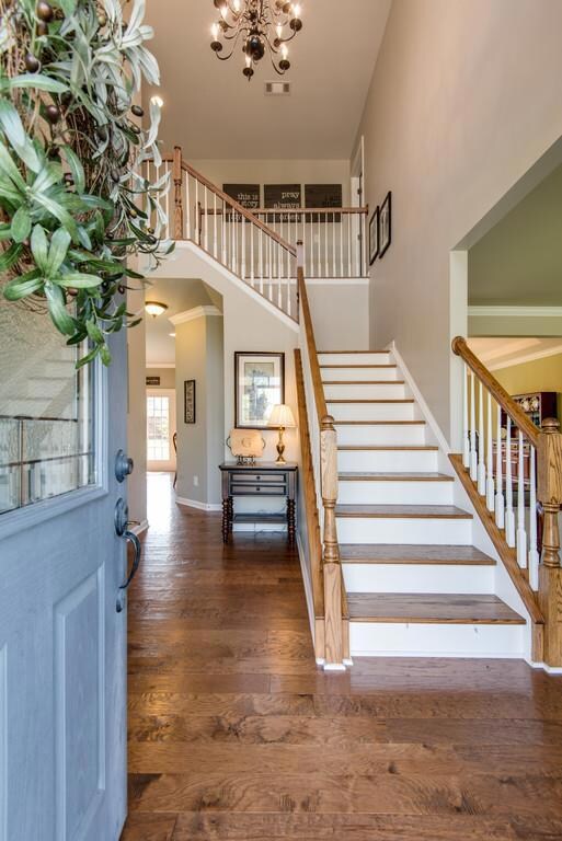 Grand Foyer with elegant wood staircase  