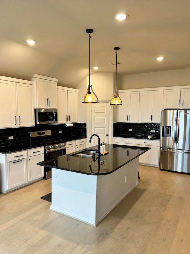 Kitchen with lots of cabinet space and island for you cooking creations!