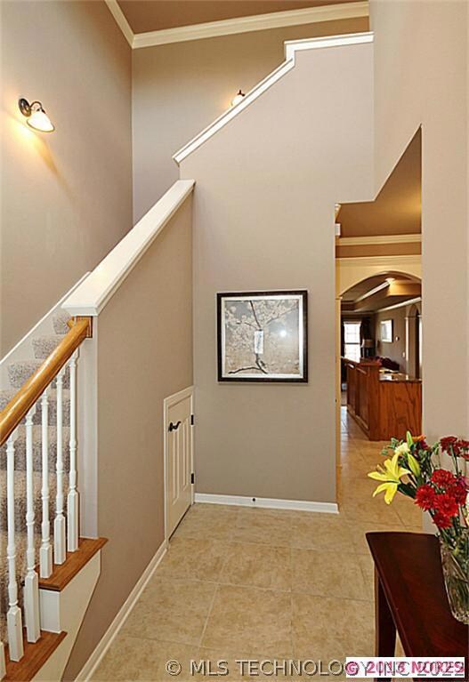 GORGEOUS TILED TWO STORY ENTRY WITH STORAGE UNDER