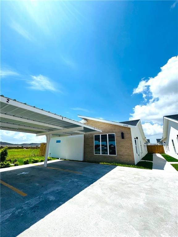 View of front of house featuring covered parking