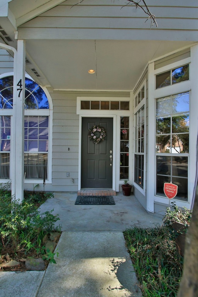 A large front porch protects guests and the main e