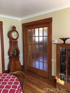 Frosted pocket doors that separate formal dining r
