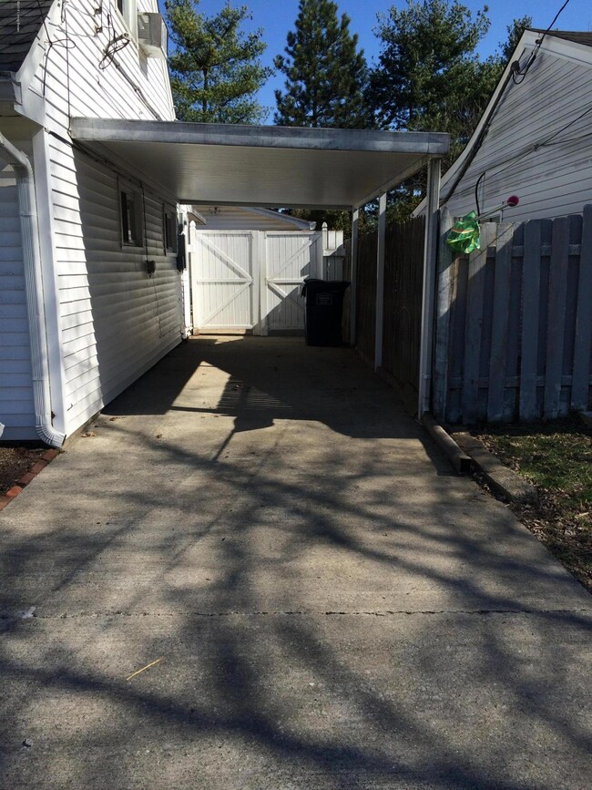 Carport with gate to backyard