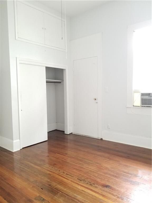 Closet with storage above, one of two window units