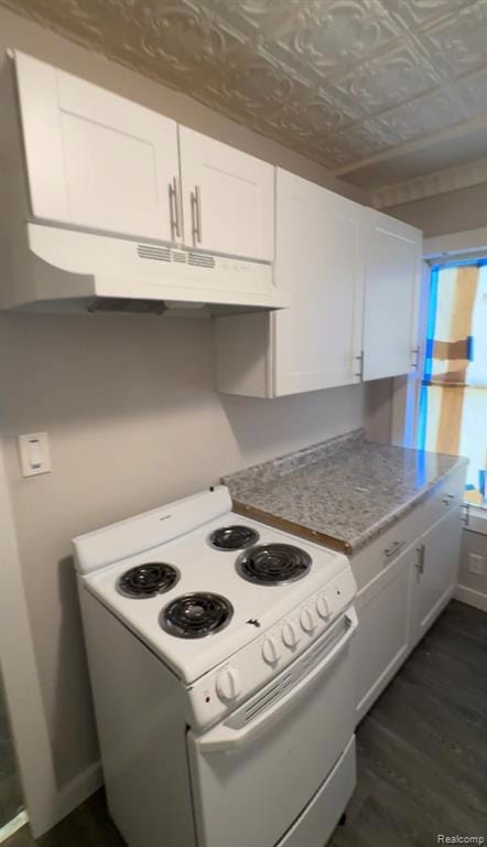 Kitchen with white range with electric cooktop, white cabinetry, an ornate ceiling, under cabinet range hood, and dark wood-style floors