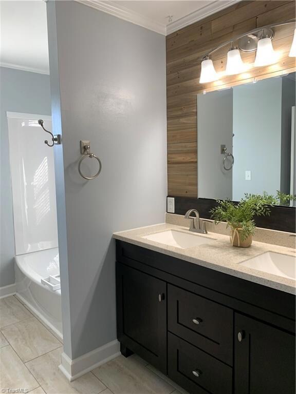 Renovated Bathroom. New Vanity, lights, tub, tile floor