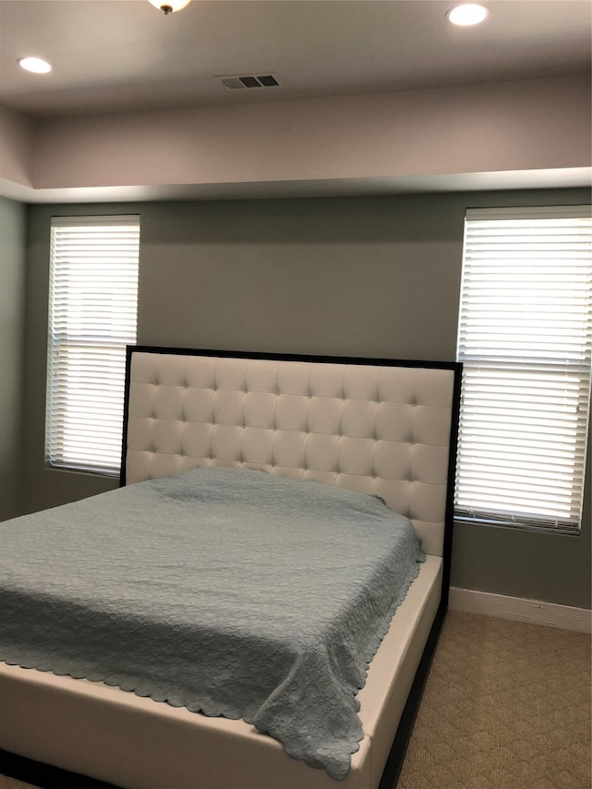 Bedroom with recessed lighting