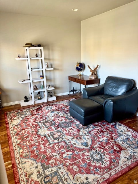 living area with wood finished floors and recessed lighting