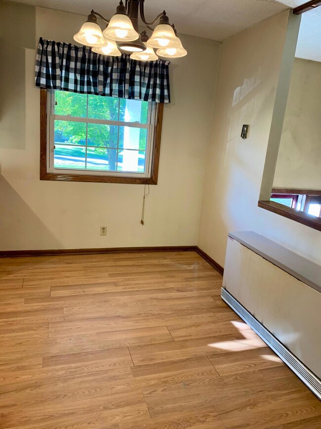 The dining room is adjacent to the kitchen.