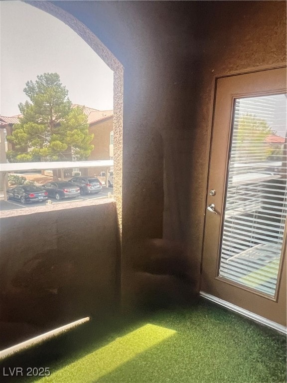 Entryway featuring carpet floors