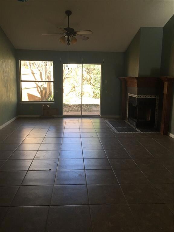 Large living area with fireplace and a sliding doo