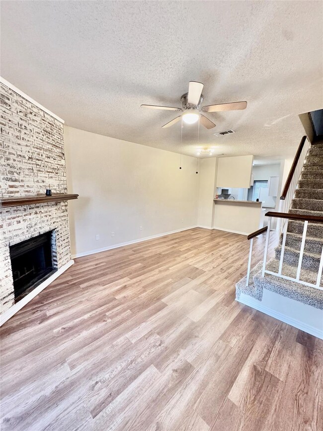 Unfurnished living room featuring visible vents, w