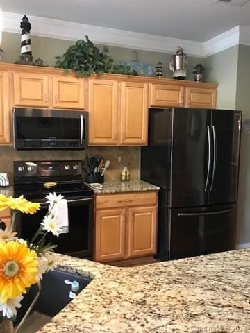 Upgraded Kitchen features beautiful Granite counte
