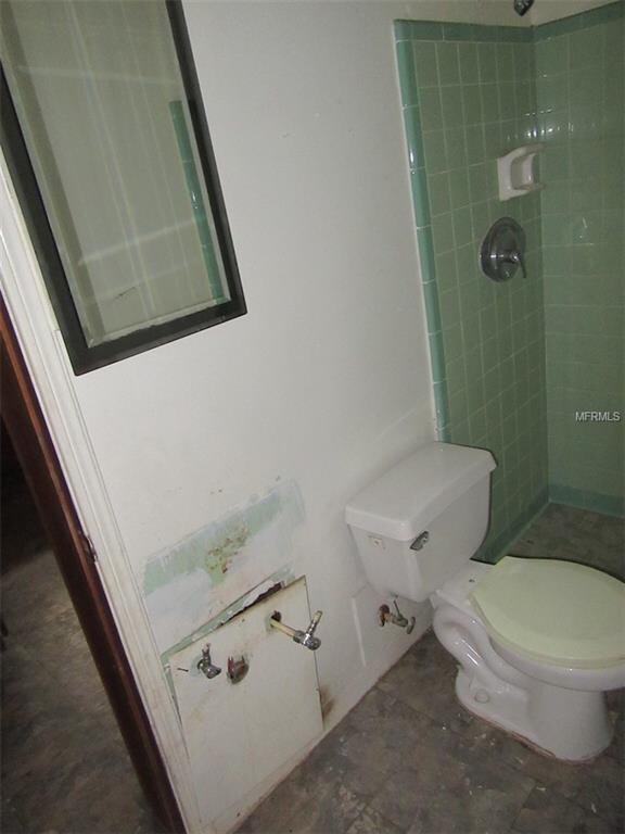 Bathroom in need of vanity and sink.