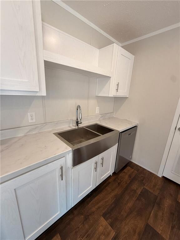 Kitchen featuring open shelves, dark wood-style flooring, white cabinetry, crown molding, and dishwasher