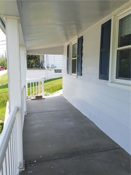 Large, inviting covered front porch with amazing v