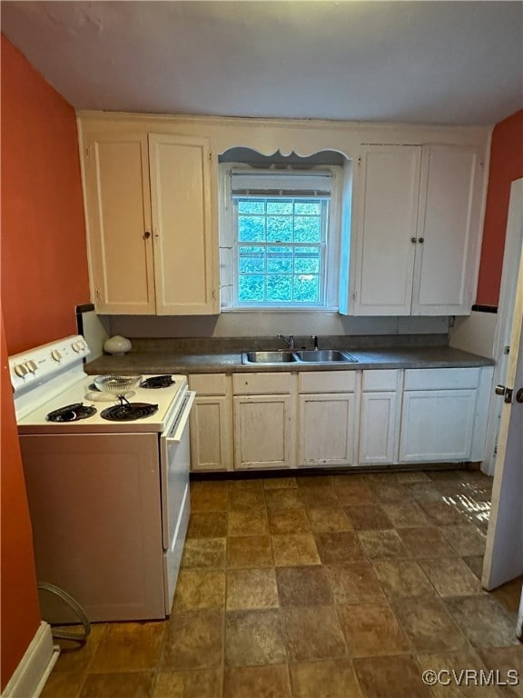 Kitchen with white range with electric cooktop, wh