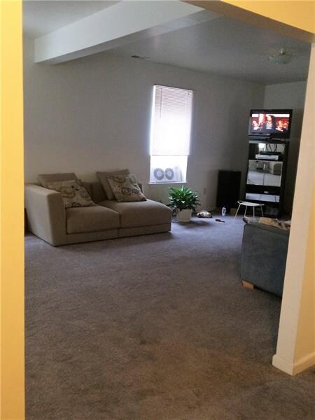 Unit 2 living room/den/bedroom on 2nd floor