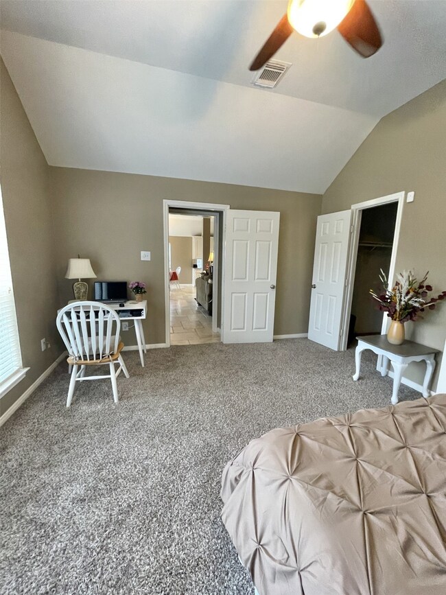 Another view of the primary bedroom