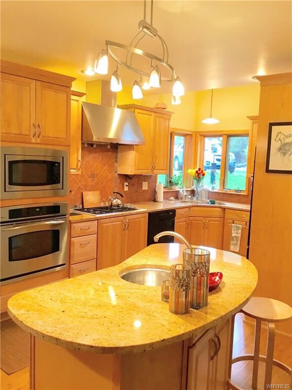 an island plumbed with electric, a recycling bin, 