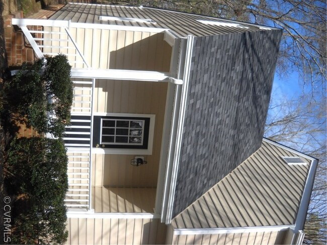 Covered porch and access to mud room with ceramic