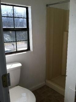 Master bath with walk in shower, new fixtures, and new tile floors.