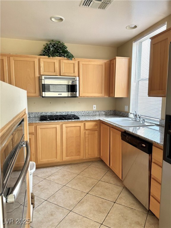 Kitchen featuring appliances with stainless steel