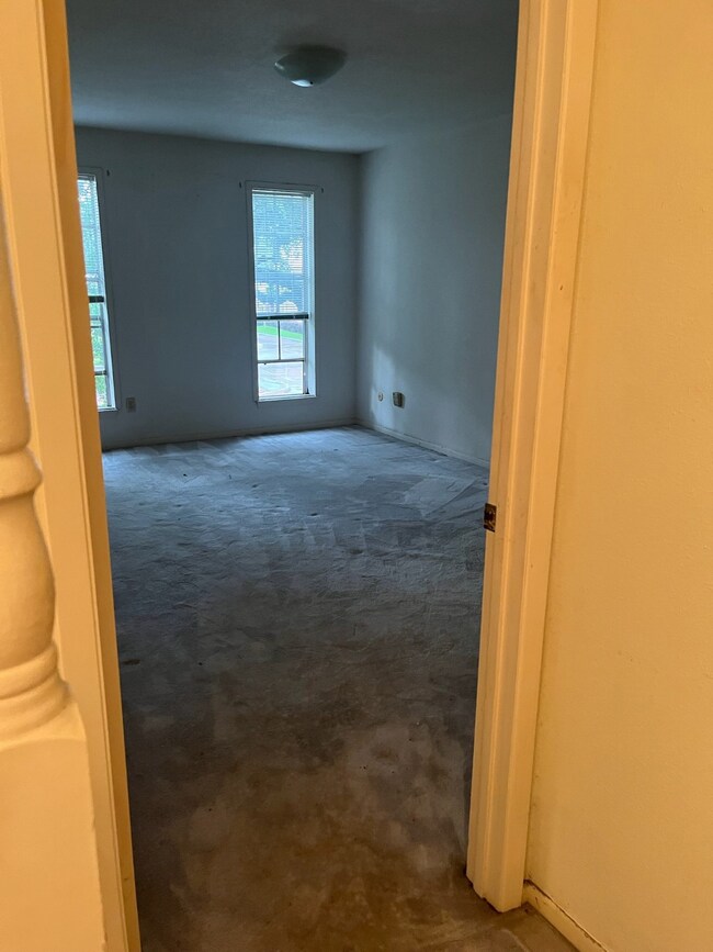 The primary bedroom features a spacious layout and