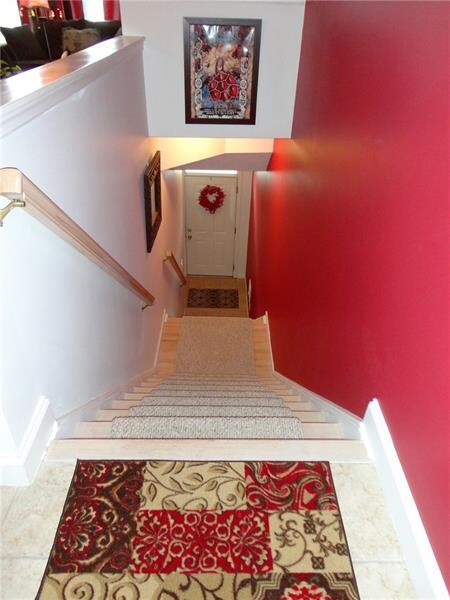 Fantastic entry with carpet runner on steps. No sl