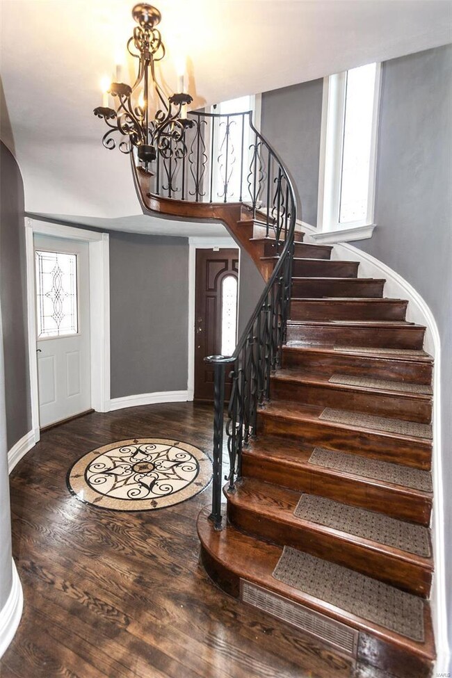 Elegant circular staircase with wrought iron raili