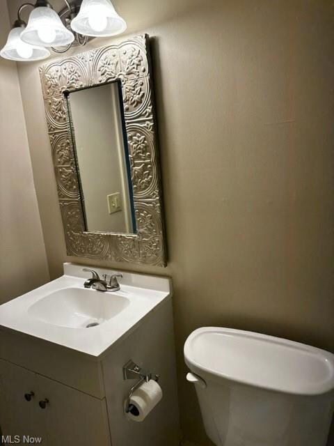 1st Fl bathroom with vanity with extensive cabinet space and mirror