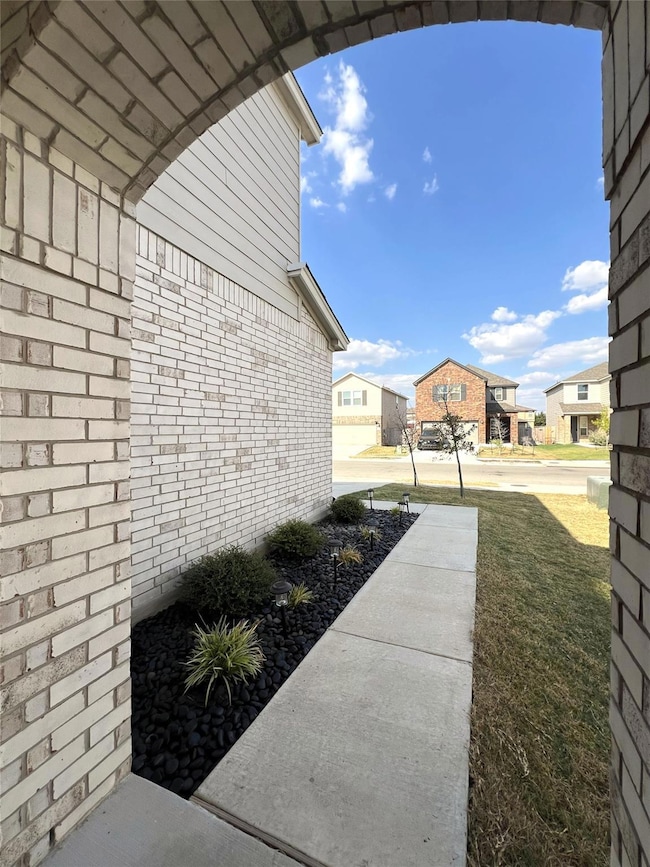 View of grassy yard with a residential view
