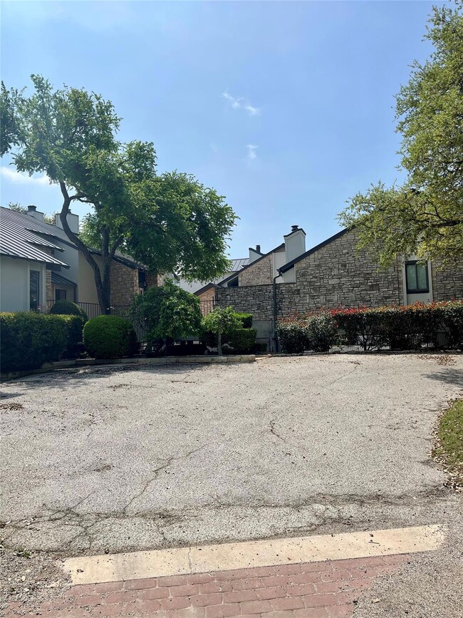View of side of property featuring stone siding