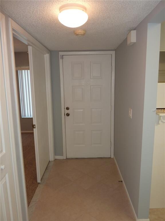 Foyer with ceramic tile floor.