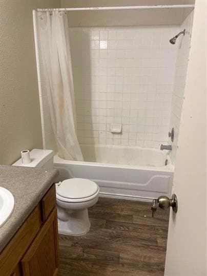 Bathroom featuring wood finished floors, shower /
