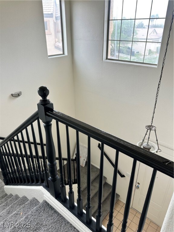 Stairway featuring tile patterned flooring