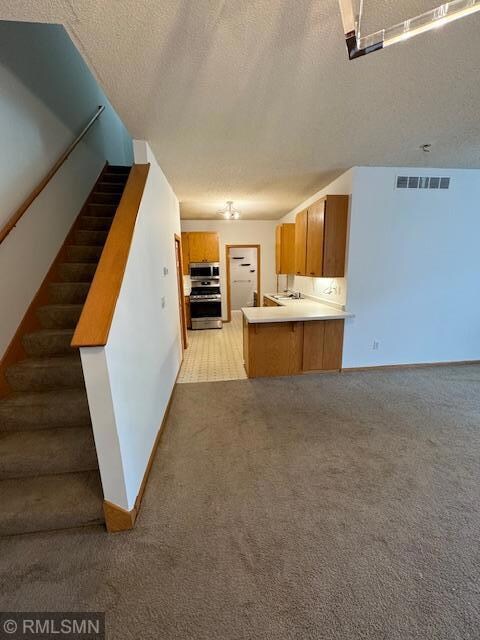 Freshly painted!   Kitchen with walk in pantry and snack bar on peninsula