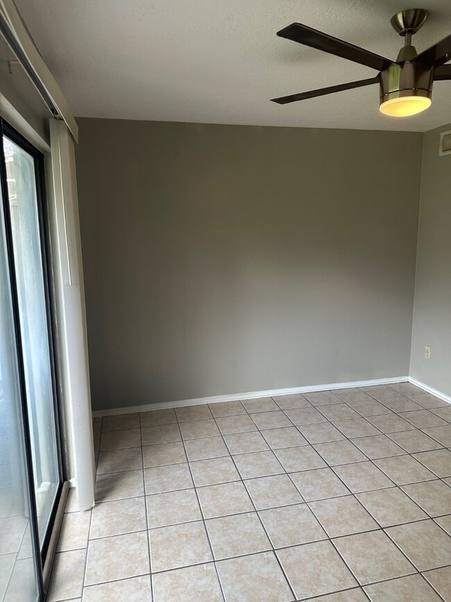 Dining area off kitchen with sliding glass door to